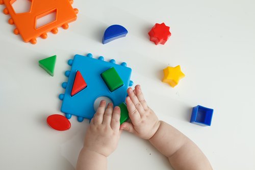 Baby playing with blocks